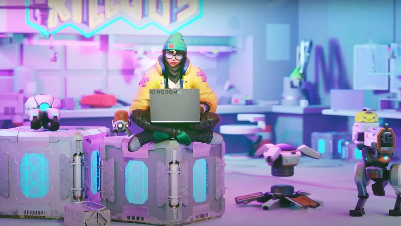 Killjoy working at the computer surrounded by gadgets